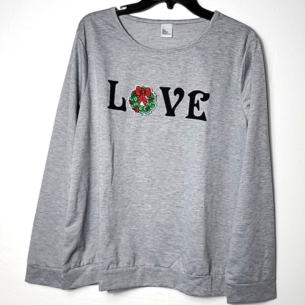 Woman's long sleeve with Holiday interchangeable Season patches. New No Tags.